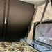 eezi-awn-sabre-hard-shell-roof-top-tent-open-interior-view-with-camouflage-patterned-mattress