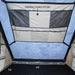 overland-vehicle-systems-ld-tmon-clamshell-aluminum-hard-shell-roof-top-tent-tan-interior-view-with-storage-options