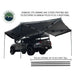 overland-vehicle-systems-nomadic-270-awning-driverside-open-rear-corner-view-on-toyota-tacoma-on-neutral-background-with-pole-description