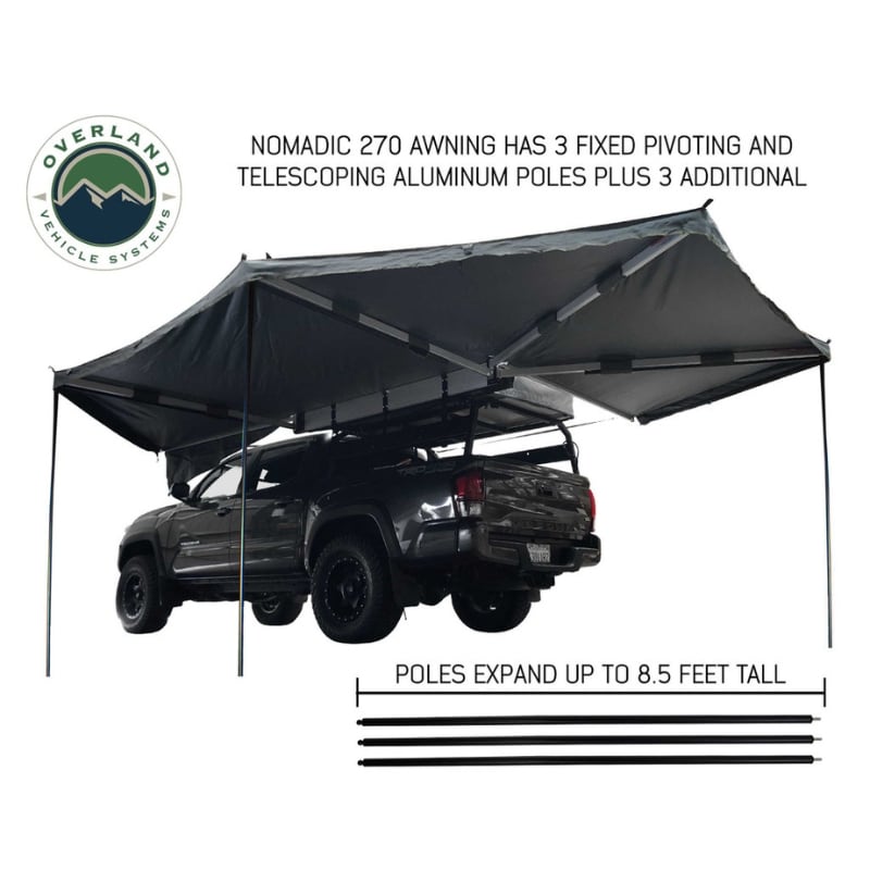overland-vehicle-systems-nomadic-270-awning-driverside-open-rear-corner-view-on-toyota-tacoma-on-neutral-background-with-pole-description