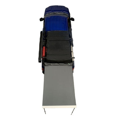 overland-vehicle-systems-nomadic-awning-4.5-ft-gray-open-drone-view-on-ford-150-on-white-background