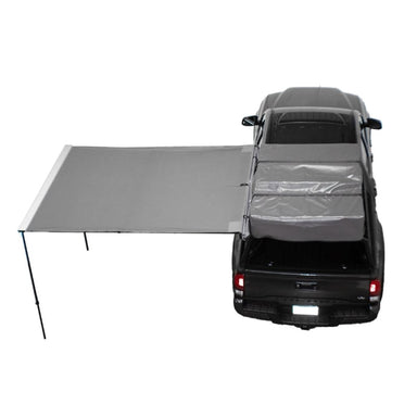 overland-vehicle-systems-nomadic-awning-6.5-ft-gray-open-top-view-on-vehicle-with-coverage-on-whit-background