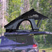 overland-vehicle-systems-xd-lohtse-hard-shell-roof-top-tent-gray-body-black-rainfly-open-side-view-on-vehicle-in-nature
