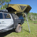 23zero-armadillo-a3-left-side-only-hard-shell-roof-top-tent-open-side-view-on-vehicle-with-ladder-in-nature