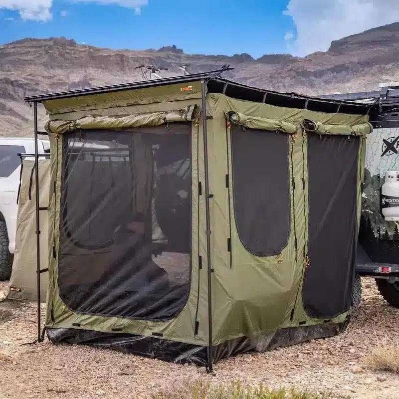 23zero-bushman-car-awning-canopy-78in-x-98in-awning-room-open-front-corner-view-on-vehicle-with-person-inside-awning-room-in-nature