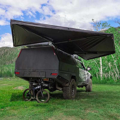 23zero-peregrine-pro-5-arm-270-awning-left-side-open-rear-corner-view-on-vehicle-in-nature