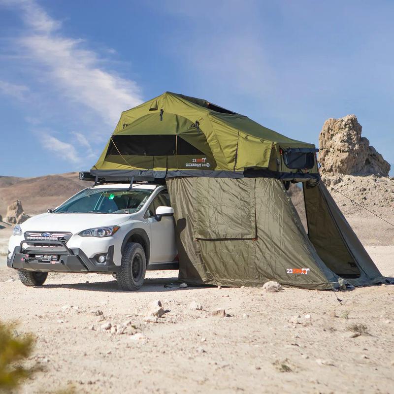 23zero-walkabout-62-2-0-soft-shell-roof-top-tent-open-front-corner-view-on-subaru-crosstrek-with-annex-in-terrain