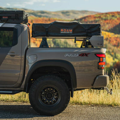 cbi-3rd-gen-nissan-frontier-bed-bars-2022-side-view-with-roof-top-tent-on-vehicle-in-nature