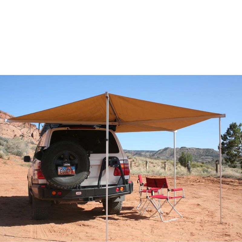 eezi-awn-bat-270-awning-beige-open-rear-back-view-on-land-cuiser-in-terrain-with-red-folding-chairs