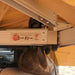 eezi-awn-bat-270-awning-beige-open-rear-close-up-view-inner-aluminum-arm-with-brand