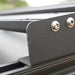 eezi-awn-blade-40th-edition-hard-shell-roof-top-tent-closed-close-up-view-of-k9-roof-rack-bracket