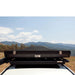 eezi-awn-blade-hard-shell-roof-top-tent-closed-front-view-on-vehicle-in-desert