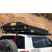 eezi-awn-blade-hard-shell-roof-top-tent-closed-rear-view-on-vehicle-on-white-backgroud