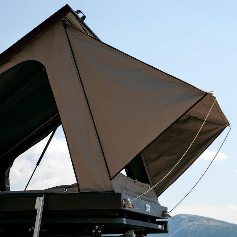 eezi-awn-blade-hard-shell-roof-top-tent-open-close-up-view-on-vehicle-with-triangular-shelter-space
