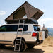 eezi-awn-blade-hard-shell-roof-top-tent-open-side-view-on-vehicle-with-extendable-ladder-in-desert