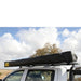 eezi-awn-dragonfly-mini-180-awning-close-side-close-up-view-inside-enclosure-in-nature