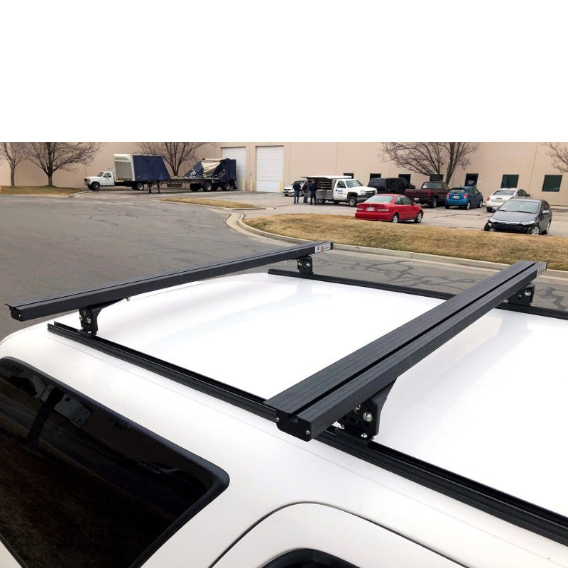 eezi-awn-k9-load-bar-kit-for-toyota-4runner-3rd-gen-front-corner-view-with-vehicles-on-parking-area