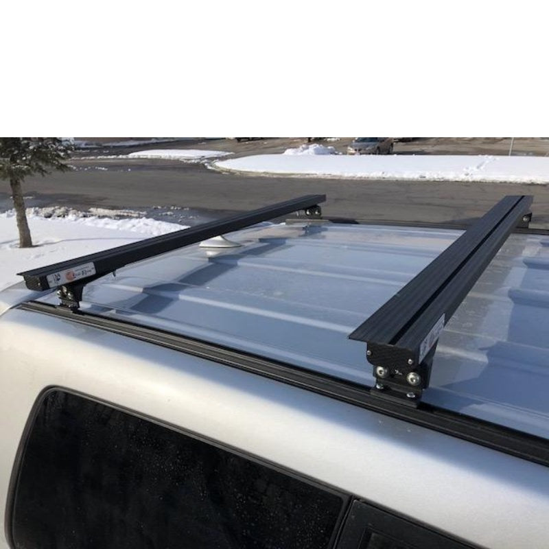 eezi-awn-k9-load-bar-kit-for-toyota-4runner-4th-gen-top-view-with-sticker-logo-on-parking-area