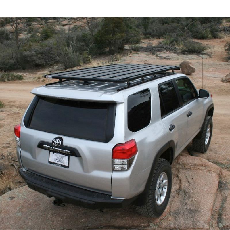 eezi-awn-k9-roof-rack-for-toyota-4runner-5th-gen-rear-view-with-logo-sticker-in-terrain