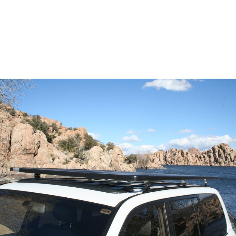 eezi-awn-k9-roof-rack-for-toyota-land-cruiser-100-series-close-up-view-with-lake-and-mountains-in-nature