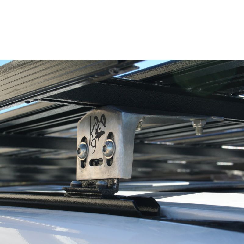 eezi-awn-k9-roof-rack-for-toyota-land-cruiser-100-series-close-up-view-with-roof-rack-fee-and-brand-logo