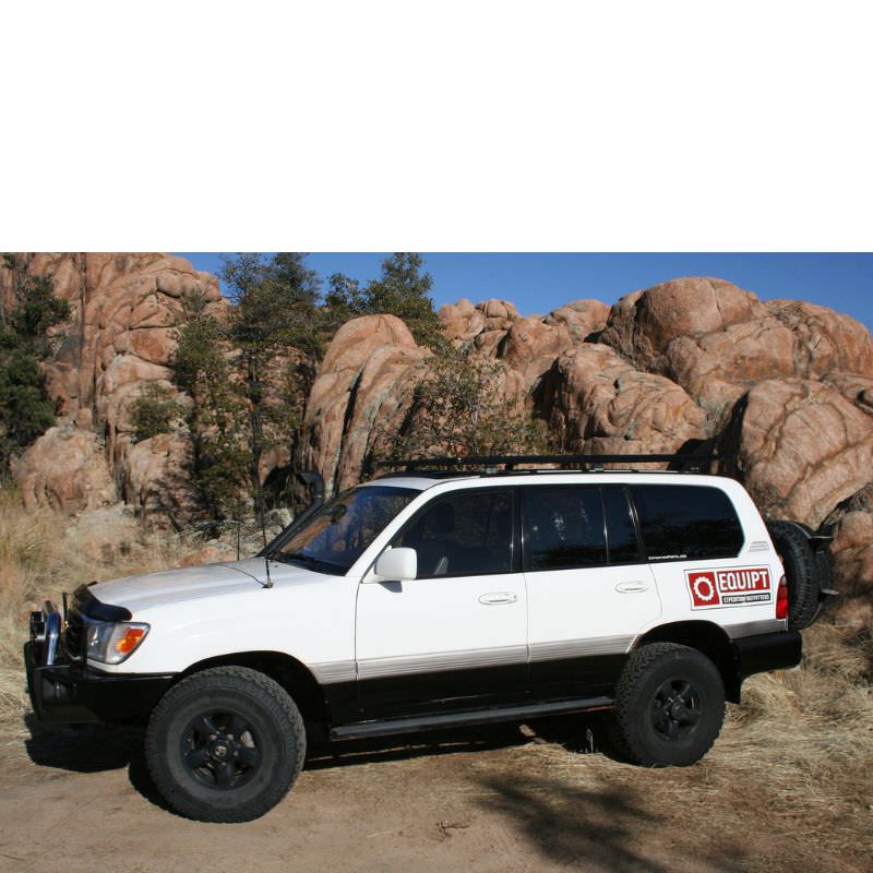 eezi-awn-k9-roof-rack-for-toyota-land-cruiser-100-series-side-view-with-boulders-in-nature