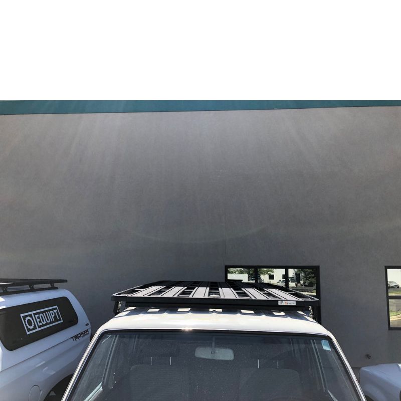 eezi-awn-k9-roof-rack-for-toyota-land-cruiser-60-front-view-with-wall-in-background-on-parking-lot