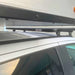 eezi-awn-k9-roof-rack-for-toyota-tundra-2nd-gen-close-up-view-with-pop-up-camper-in-parking-area