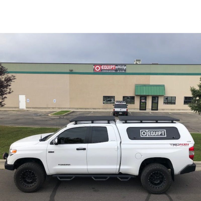 eezi-awn-k9-roof-rack-for-toyota-tundra-2nd-gen-side-view-with-building-on-background-in-parking-area