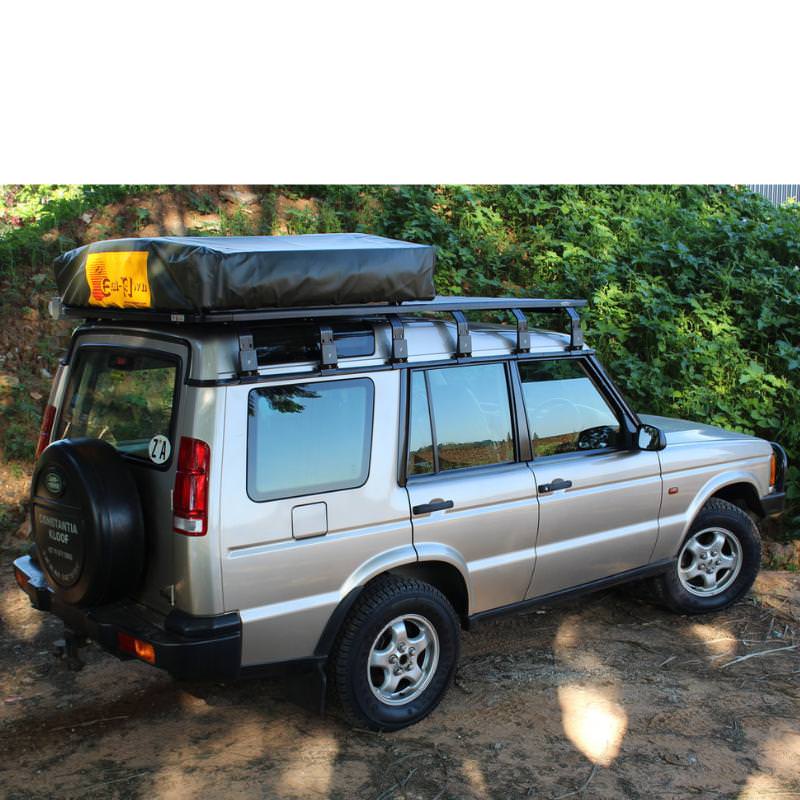 eezi-awn-k9-roof-rack-leg-side-view-on-land-rover-discovery-in-nature