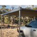 eezi-awn-lite-awning-biege-open-side-view-on-vehicle-in-nature