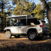 eezi-awn-lite-awning-gray-open-side-view-on-toyota-4runner-in-terrain