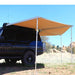 eezi-awn-manta-270-awning-beige-open-rear-side-view-on-land-cruiser-in-nature