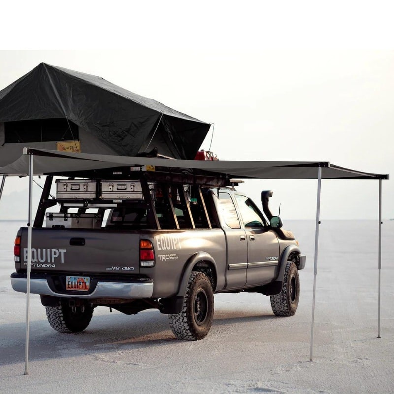 eezi-awn-manta-270-awning-gray-open-rear-back-view-on-toyota-tundra-with-rooftop-tent-in-terrain