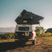 eezi-awn-sabre-hard-shell-roof-top-tent-open-rear-view-on-vehicle-with-ladder-in-nature