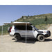 eezi-awn-series-2000-awning-beige-open-side-view-on-land-cruiser-in-terrain