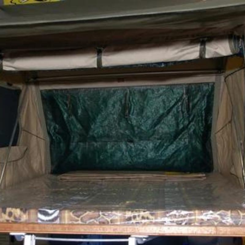 eezi-awn-series-3-soft-shell-roof-top-tent-olive-open-interior-view-of-built-in-matress-and-bug-mesh