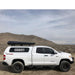 eezi-awn-stealth-hard-shell-roof-top-tent-closed-side-view-on-toyota-tundra-in-desert