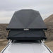 eezi-awn-stealth-hard-shell-roof-top-tent-open-front-close-up-view-on-toyota-tundra-in-desert