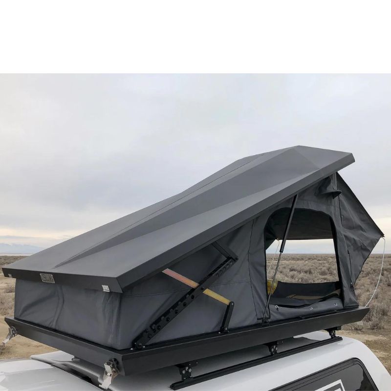 eezi-awn-stealth-hard-shell-roof-top-tent-open-front-corner-close-up-view-with-pitched-rainfly-on-toyota-tundra-in-desert