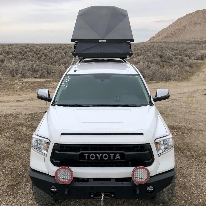 eezi-awn-stealth-hard-shell-roof-top-tent-open-front-view-on-toyota-tundra-in-desert