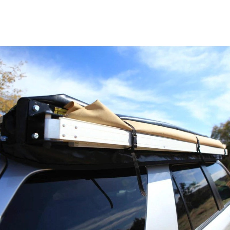 eezi-awn-swift-awning-beige-close-opposite-corner-view-on-vehicle-in-terrain