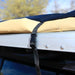 eezi-awn-swift-awning-beige-close-side-view-close-up-with-buckle-on-vehicle-in-terrain
