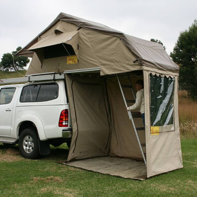 eezi-awn-xklusiv-soft-shell-roof-top-tent-beige-open-rear-corner-view-on-vehicle-with-spacious-enclosed-area-in-nature
