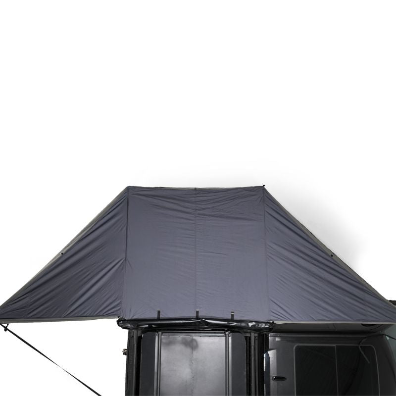 freespirit-recreation-180-degree-awning-black-open-top-view-on-vehicle-on-white-background