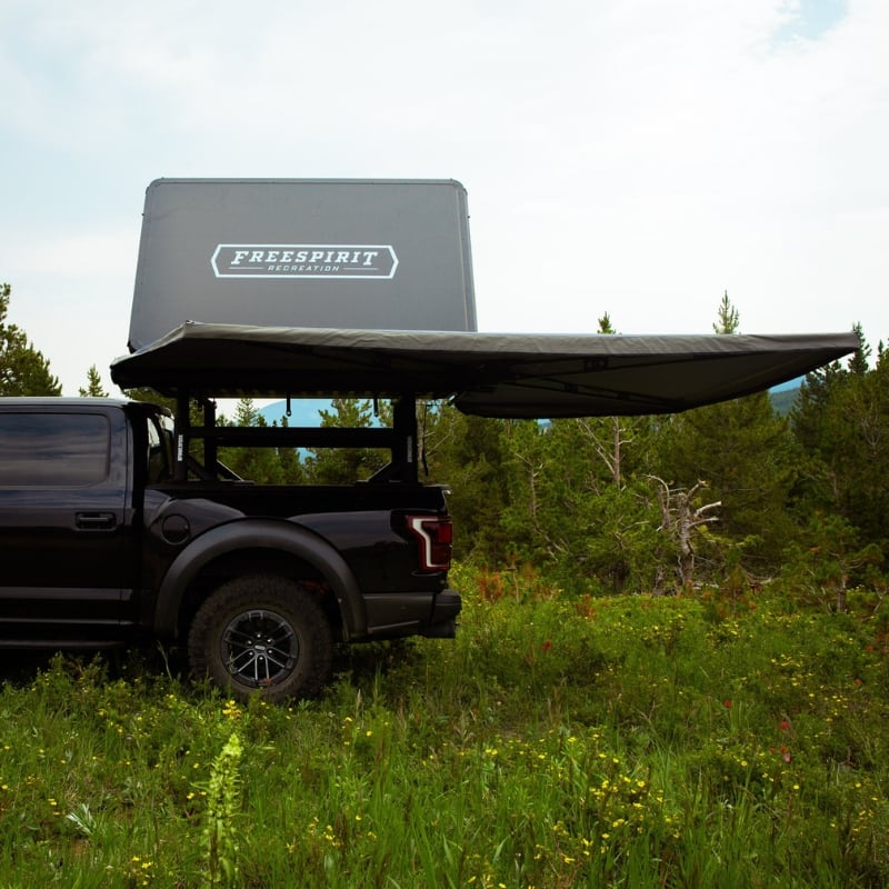freespirit-recreation-270-awning-driver-side-open-side-view-on-ford-f150-in-nature