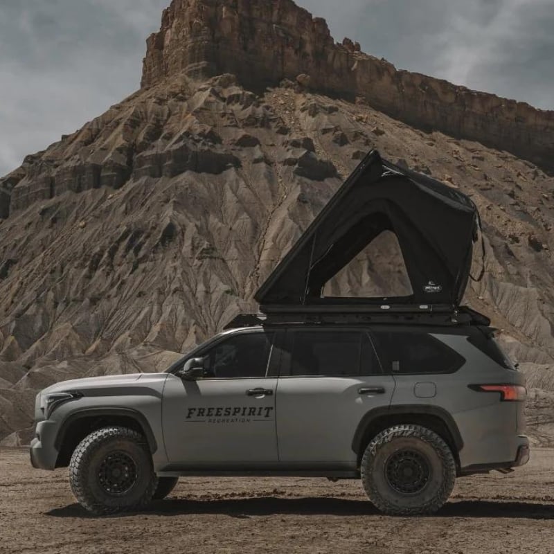 freespirit-recreation-aspen-lite-hard-shell-roof-top-tent-black-open-side-view-on-toyota-sequoia-in-desert