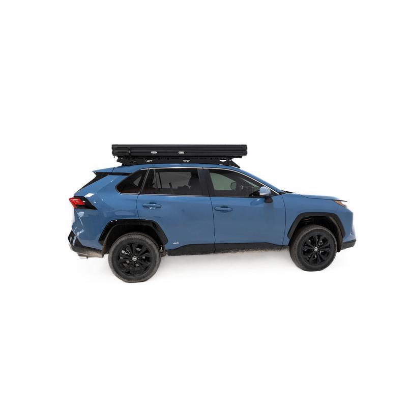 freespirit-recreation-aspen-lite-standard-rooftop-tent-closed-side-view-on-toyota-rav4-on-white-background