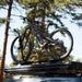 freespirit-recreation-aspen-v2-hard-shell-roof-top-tent-black-closed-on-top-of-vehicle-with-bike-in-nature