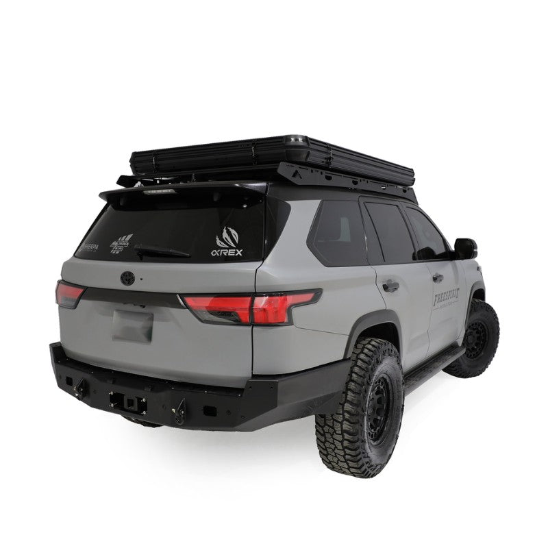 freespirit-recreation-aspen-v2-hard-shell-roof-top-tent-black-closed-rear-corner-view-on-top-toyota-sequoia-on-white-background